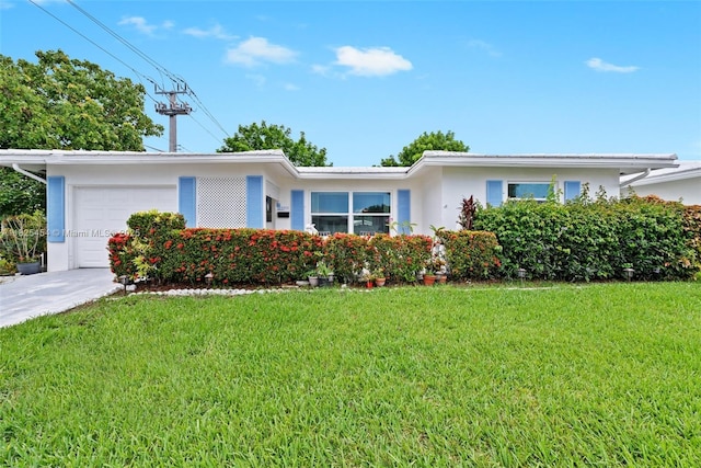 6905 NW 73rd St, Tamarac, FL 33321 - single story home with an attached garage, stucco siding, a front lawn, and driveway