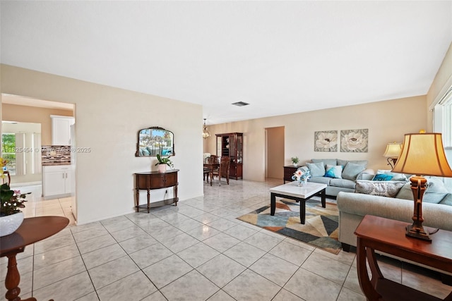 6905 NW 73rd St, Tamarac, FL 33321 - living room with light tile patterned flooring and healthy amount of natural light