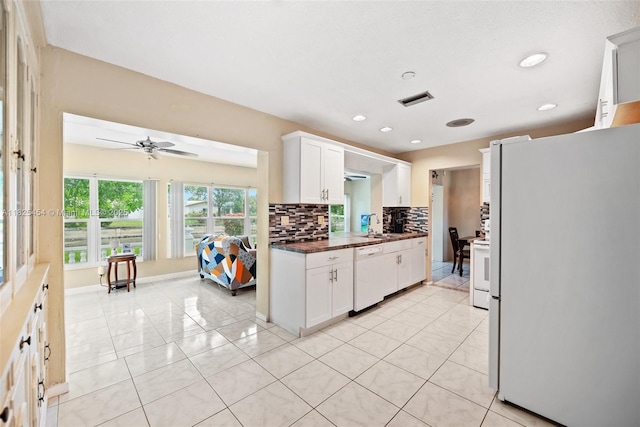 6905 NW 73rd St, Tamarac, FL 33321 - kitchen featuring white appliances, backsplash, ceiling fan, white cabinets, and recessed lighting
