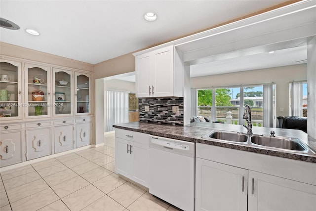 6905 NW 73rd St, Tamarac, FL 33321 - kitchen featuring white dishwasher, light tile patterned flooring, white cabinets, dark countertops, and recessed lighting