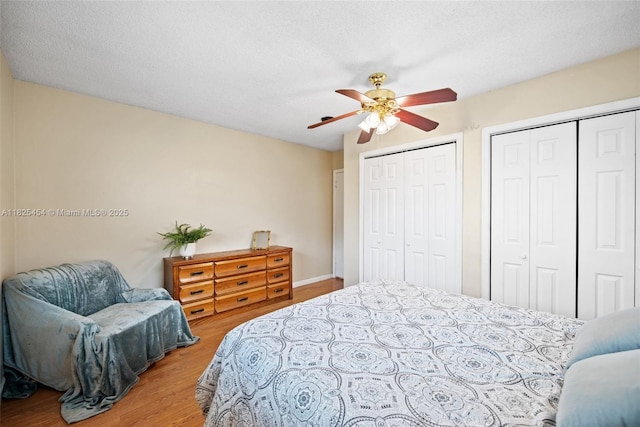 6905 NW 73rd St, Tamarac, FL 33321 - bedroom featuring wood finished floors, multiple closets, and ceiling fan