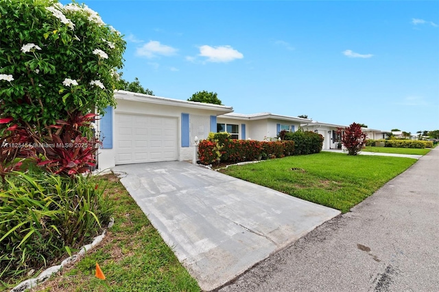 6905 NW 73rd St, Tamarac, FL 33321 - ranch-style home featuring an attached garage, a front lawn, concrete driveway, and stucco siding