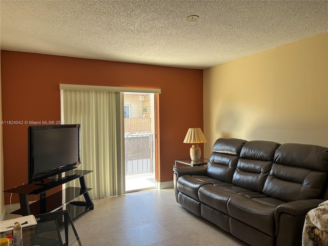 1635 W 44th Pl Unit 509, Hialeah, FL 33012 - living room featuring a textured ceiling