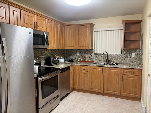 1635 W 44th Pl Unit 509, Hialeah, FL 33012 - kitchen with appliances with stainless steel finishes, tasteful backsplash, and light stone counters