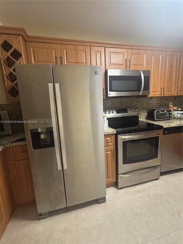 1635 W 44th Pl Unit 509, Hialeah, FL 33012 - kitchen featuring appliances with stainless steel finishes, light stone counters, tasteful backsplash, and brown cabinets