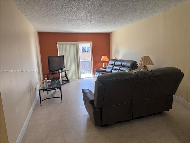 1635 W 44th Pl Unit 509, Hialeah, FL 33012 - living room with a textured ceiling and baseboards