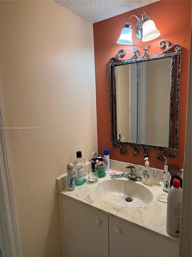 1635 W 44th Pl Unit 509, Hialeah, FL 33012 - bathroom featuring vanity and a textured ceiling