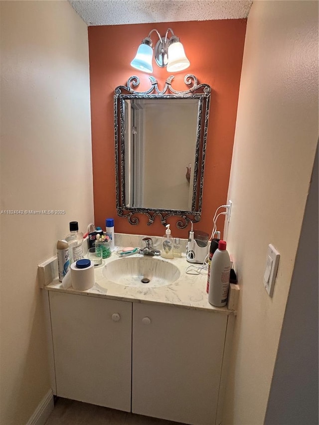 1635 W 44th Pl Unit 509, Hialeah, FL 33012 - bathroom featuring vanity and a textured ceiling
