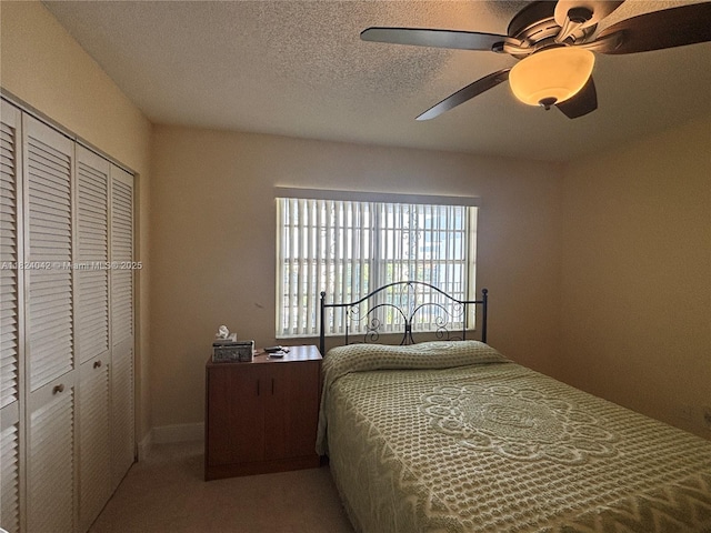 1635 W 44th Pl Unit 509, Hialeah, FL 33012 - bedroom featuring a closet, carpet floors, a ceiling fan, and a textured ceiling