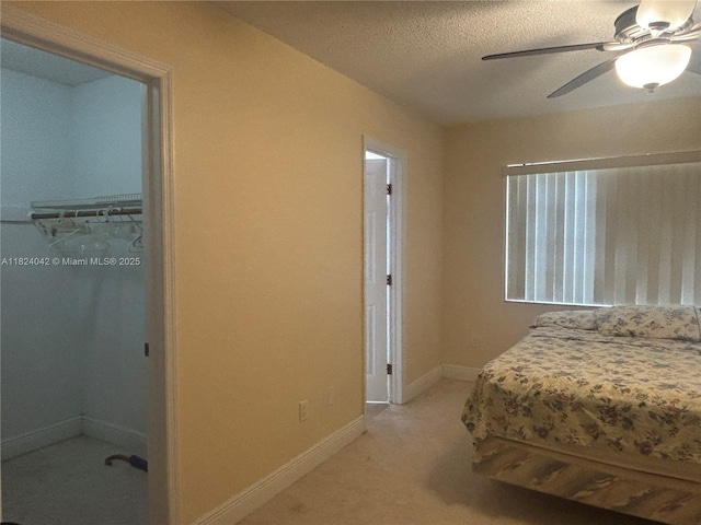1635 W 44th Pl Unit 509, Hialeah, FL 33012 - bedroom featuring light colored carpet, a textured ceiling, and ceiling fan