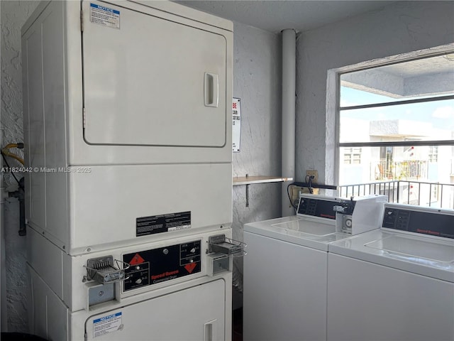 1635 W 44th Pl Unit 509, Hialeah, FL 33012 - washroom featuring stacked washer / drying machine, a textured wall, and separate washer and dryer