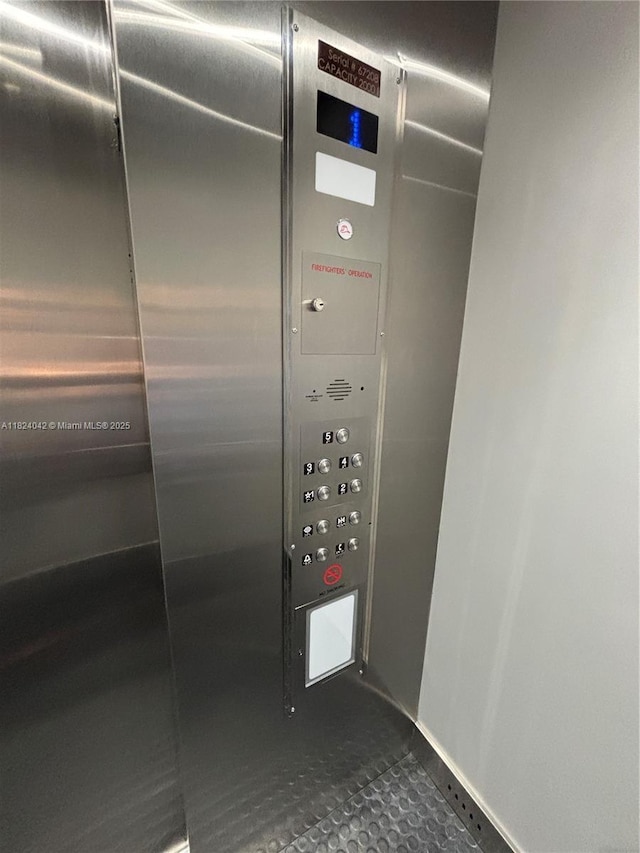 1635 W 44th Pl Unit 509, Hialeah, FL 33012 - elevator with baseboards and mail area