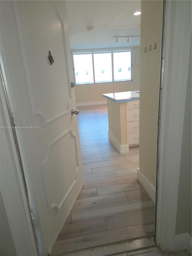 7135 Collins Ave Unit 424, Miami Beach, FL 33141 - corridor featuring light wood finished floors and baseboards