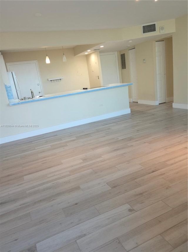 7135 Collins Ave Unit 424, Miami Beach, FL 33141 - unfurnished room with light wood-style flooring and recessed lighting