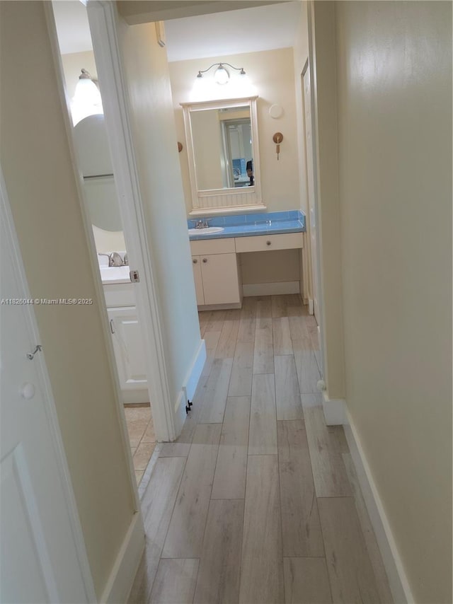 7135 Collins Ave Unit 424, Miami Beach, FL 33141 - hall with light wood-style flooring and an office area