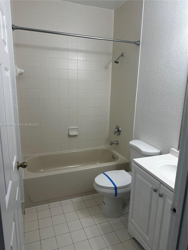 2452 SE 14th Ave Unit 284, Homestead, FL 33035 - full bath featuring a textured wall, tub / shower combination, vanity, and tile patterned floors