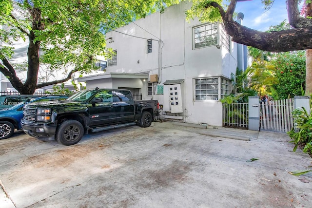 631 Euclid Ave Unit 8, Miami Beach, FL 33139 - view of side of property with a gate and stucco siding