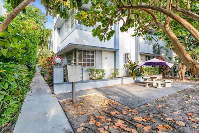 631 Euclid Ave Unit 8, Miami Beach, FL 33139 - view of front of house featuring a patio area, stucco siding, and a balcony