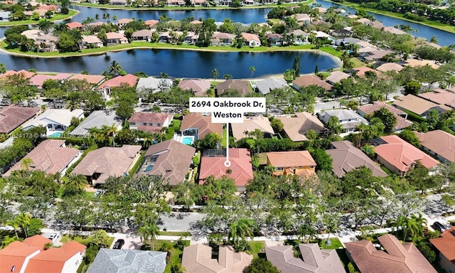 2694 Oakbrook Dr, Weston, FL 33332 - aerial perspective of suburban area featuring a nearby body of water