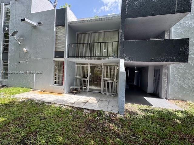 8841 W Flagler St Unit 108, Miami, FL 33174 - rear view of house featuring stucco siding