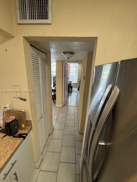 8841 W Flagler St Unit 108, Miami, FL 33174 - hall featuring light tile patterned flooring