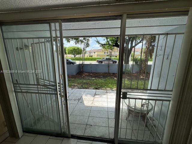 8841 W Flagler St Unit 108, Miami, FL 33174 - doorway with tile patterned flooring