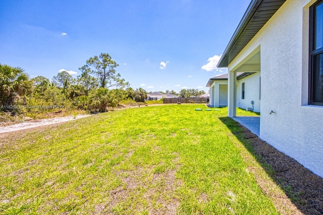 817/819 Eisenhower Blvd, Lehigh Acres, FL 33974 - view of grassy yard