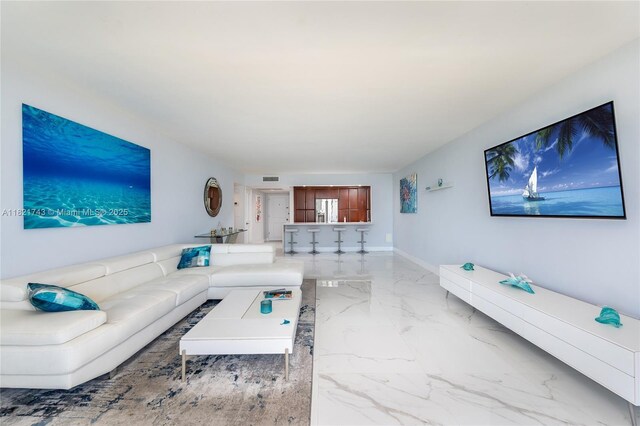 5555 Collins Ave Unit 7N, Miami Beach, FL 33140 - living area featuring marble tiled floors