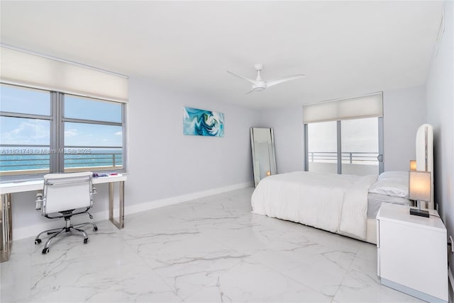 5555 Collins Ave Unit 7N, Miami Beach, FL 33140 - bedroom featuring an office area, light marble finish floors, a water view, and a ceiling fan