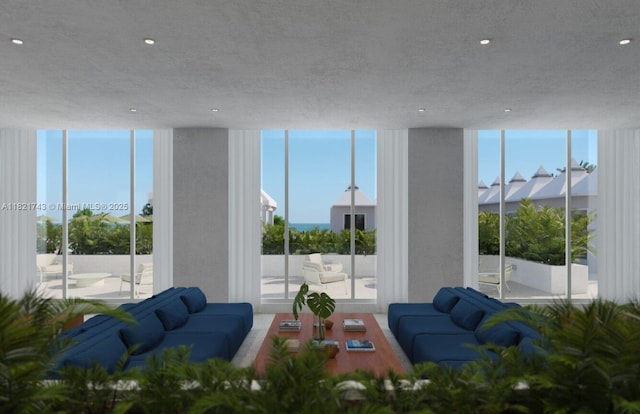 5555 Collins Ave Unit 7N, Miami Beach, FL 33140 - living room featuring a wall of windows, recessed lighting, and healthy amount of natural light