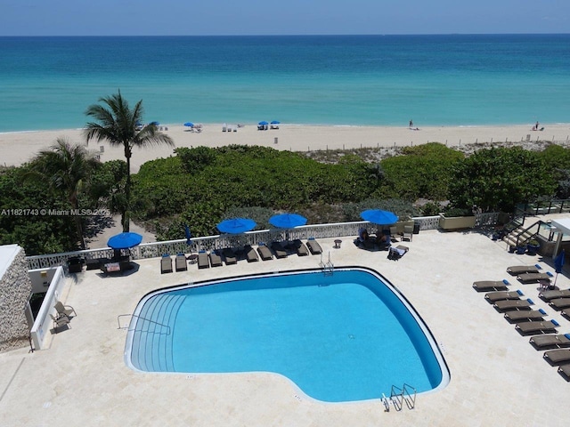 5555 Collins Ave Unit 7N, Miami Beach, FL 33140 - community pool with view of water and beach