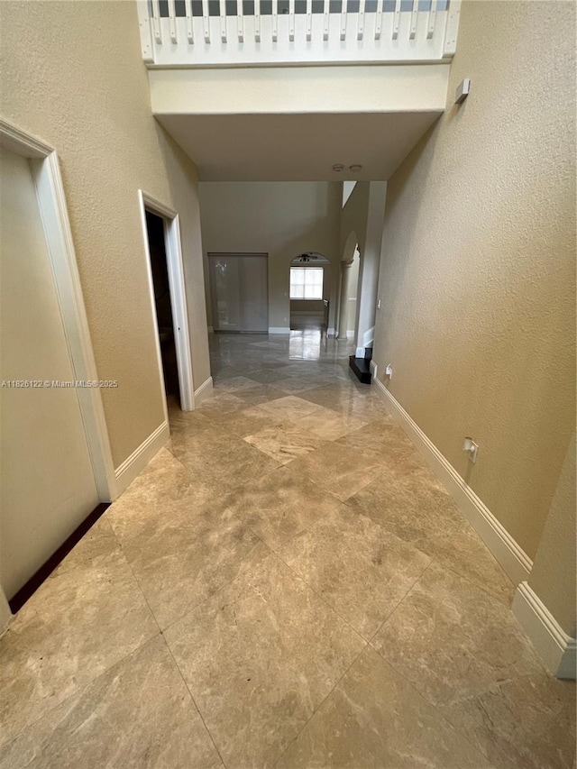 16546 SW 39th St, Miramar, FL 33027 - hallway featuring arched walkways and a textured wall