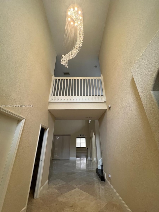 16546 SW 39th St, Miramar, FL 33027 - stairs featuring a high ceiling and a chandelier