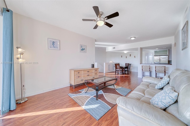6440 NW 114th Ave Unit 434, Doral, FL 33178 - living area featuring light wood finished floors and ceiling fan