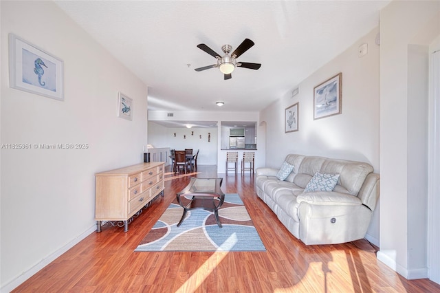6440 NW 114th Ave Unit 434, Doral, FL 33178 - living area with ceiling fan and light wood-style floors