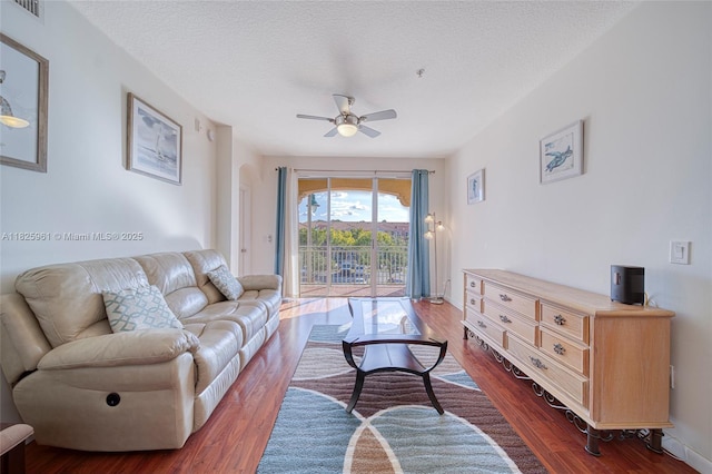 6440 NW 114th Ave Unit 434, Doral, FL 33178 - living room featuring ceiling fan, dark wood-style flooring, and a textured ceiling