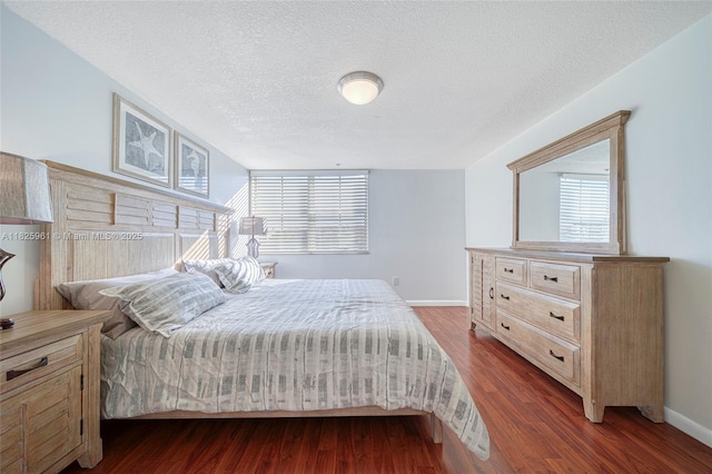 6440 NW 114th Ave Unit 434, Doral, FL 33178 - bedroom featuring dark wood-type flooring and a textured ceiling