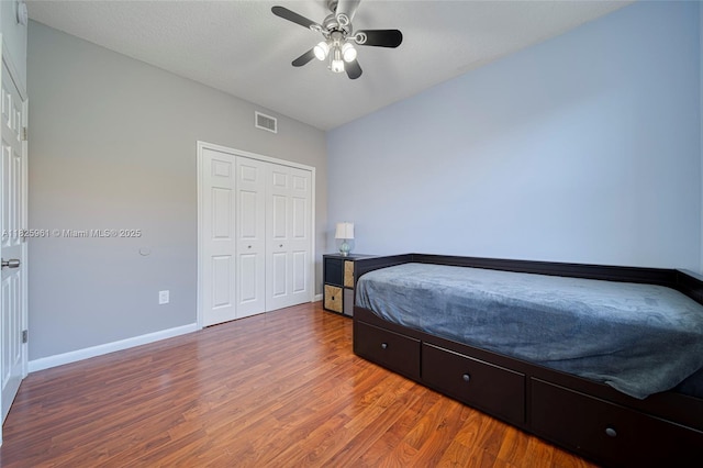 6440 NW 114th Ave Unit 434, Doral, FL 33178 - bedroom featuring wood finished floors, a closet, and a ceiling fan