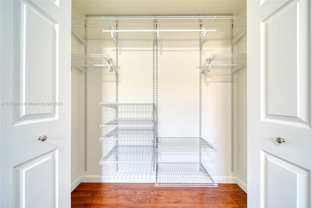 6440 NW 114th Ave Unit 434, Doral, FL 33178 - spacious closet featuring wood finished floors