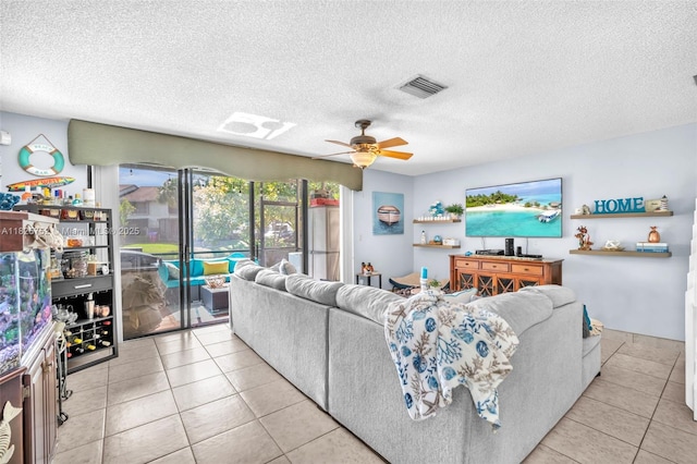 4552 Carambola Cir S Unit 27247, Coconut Creek, FL 33066 - tiled living area with a ceiling fan and a textured ceiling
