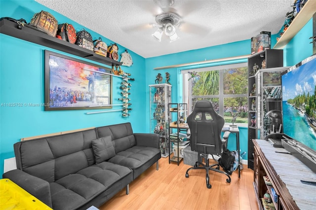 4552 Carambola Cir S Unit 27247, Coconut Creek, FL 33066 - office with a textured ceiling, a ceiling fan, and wood finished floors