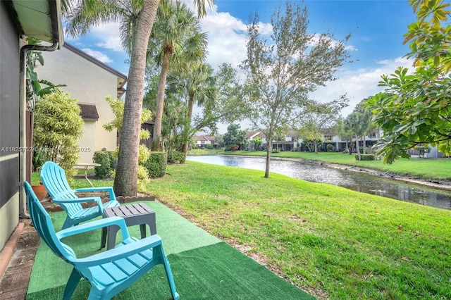 4552 Carambola Cir S Unit 27247, Coconut Creek, FL 33066 - view of green lawn featuring a water view
