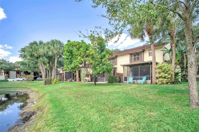 4552 Carambola Cir S Unit 27247, Coconut Creek, FL 33066 - view of grassy yard featuring a sunroom