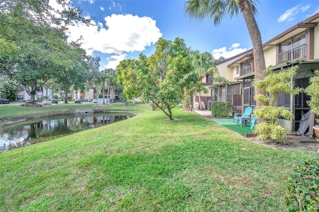 4552 Carambola Cir S Unit 27247, Coconut Creek, FL 33066 - view of grassy yard featuring a water view