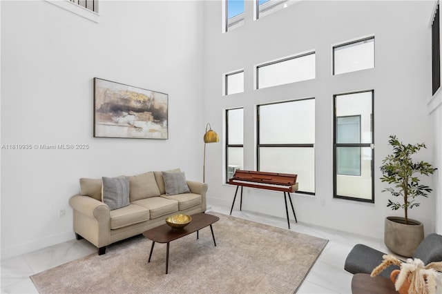 20273 Bandon Dunes Rd, Boca Raton, FL 33434 - living room featuring a towering ceiling and marble look tiles