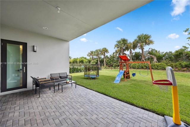 20273 Bandon Dunes Rd, Boca Raton, FL 33434 - view of patio / terrace with a playground, a trampoline, and an outdoor living space