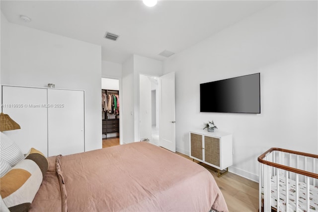 20273 Bandon Dunes Rd, Boca Raton, FL 33434 - bedroom featuring wood finished floors and a closet