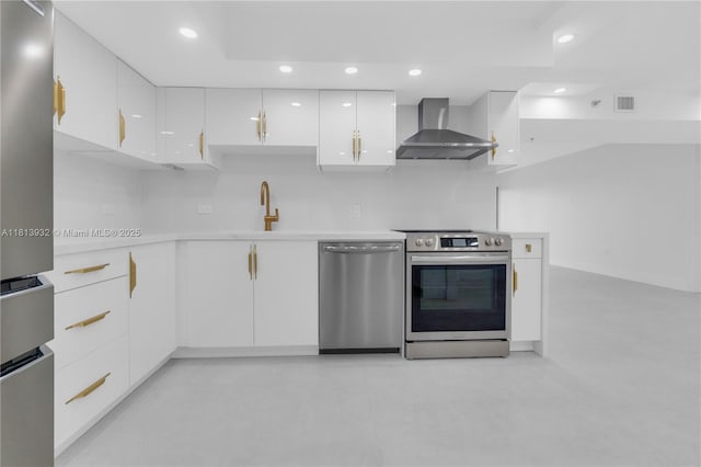 1201 S Ocean Dr Unit 507S, Hollywood, FL 33019 - kitchen with wall chimney exhaust hood, stainless steel appliances, white cabinetry, light countertops, and recessed lighting