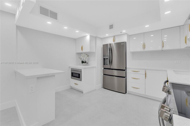 1201 S Ocean Dr Unit 507S, Hollywood, FL 33019 - kitchen featuring appliances with stainless steel finishes, white cabinetry, recessed lighting, and modern cabinets