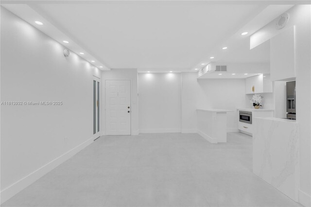 1201 S Ocean Dr Unit 507S, Hollywood, FL 33019 - basement with recessed lighting and stainless steel refrigerator with ice dispenser